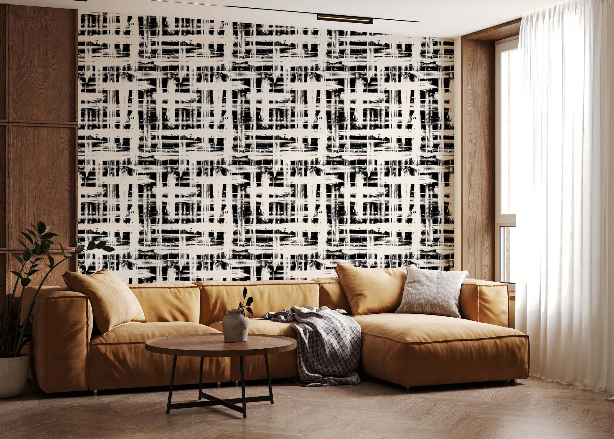 Monochrome crosshatch texture wallpaper behind a tan leather sectional GD12489