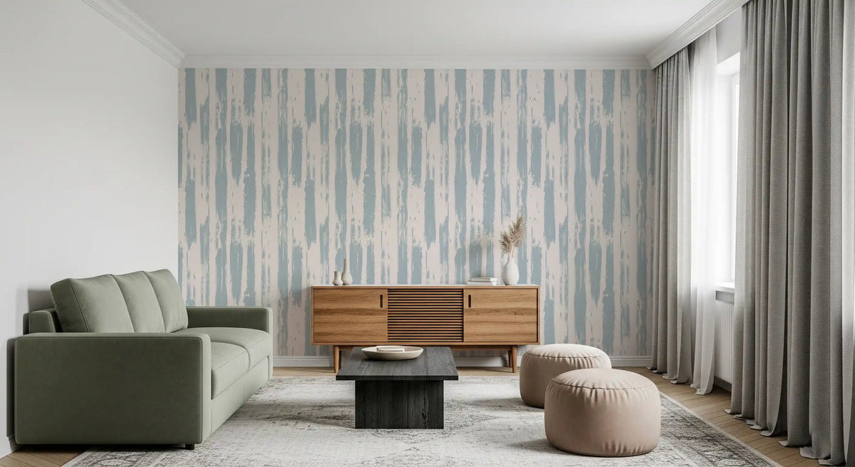 Painted stripe wallpaper behind an olive green sofa and wood sideboard GD12490