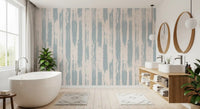 Blue painted stripe wallpaper in a bathroom with freestanding tub and plants GD12490