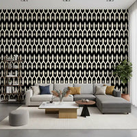 Grey sectional and shelf in a living room styled with black and cream diamond wallpaper GD12494