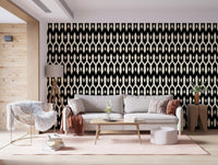 Living room with a grey sofa and pink throw on black and cream diamond wallpaper GD12494