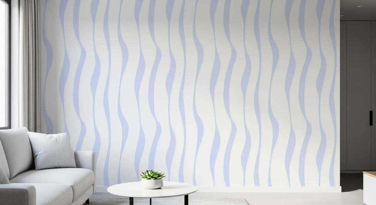 Soft blue wave wallpaper feature wall by a light grey sofa and side table GD12498