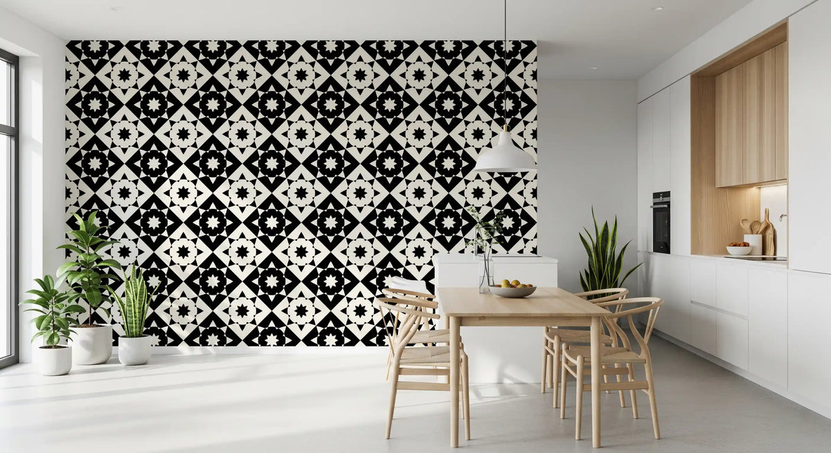 Geometric starburst wallpaper in a dining nook with a wooden table and white cabinets GD12503