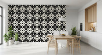 Geometric starburst wallpaper in a dining nook with a wooden table and white cabinets GD12503