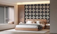 Starburst motif wallpaper behind a tan upholstered bed near window blinds GD12503