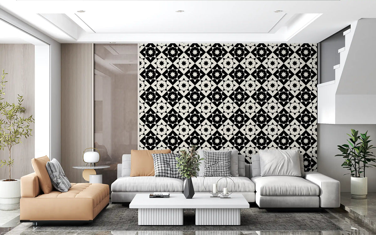 Black and white geometric motif wallpaper in a lounge with a grey sofa and tan bench GD12503