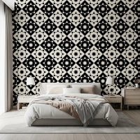 Monochrome geometric wallpaper above a white bed with matching nightstands GD12503