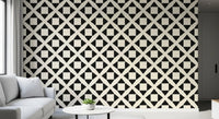 Diamond grid wallpaper close up behind a white sofa and round side table GD12504