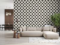 Minimalist diamond grid wallpaper behind a beige sectional and wood slat divider GD12504