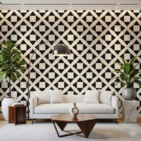 Diamond grid wallpaper behind a cream sofa with tall plants and an arc lamp GD12504
