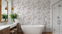 Soft meadow botanical wallpaper in a bathroom with a freestanding tub and gold mirror GD12505