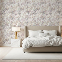 Botanical meadow wallpaper behind a beige bed with a gold lamp and marble nightstand GD12505