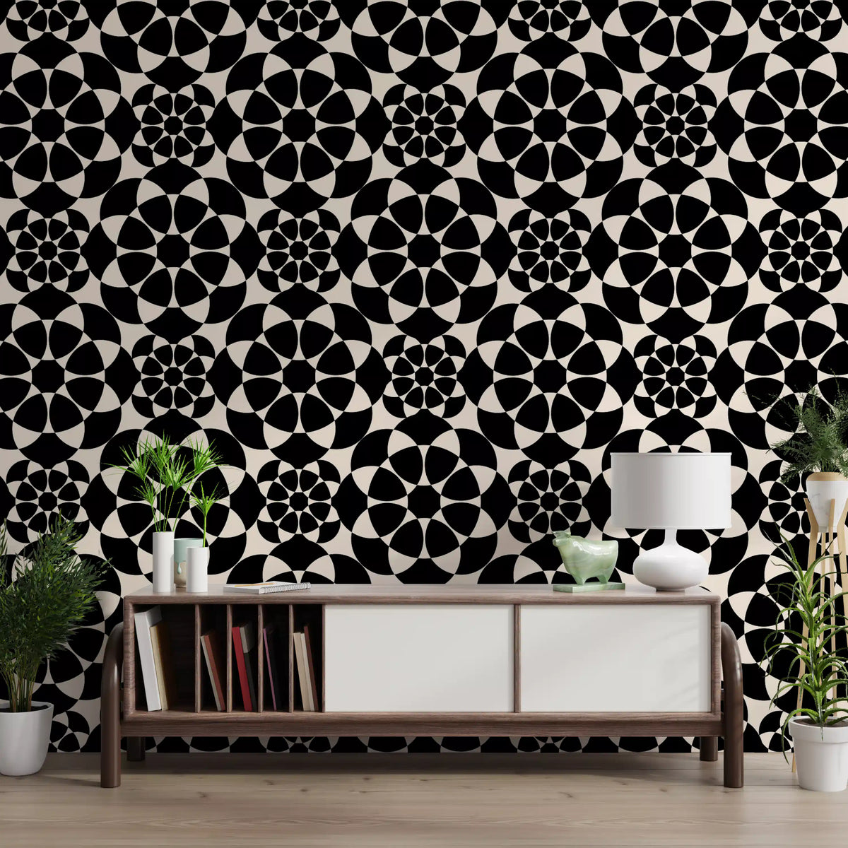 Monochrome circle grid wallpaper above a wooden console with plants and a lamp GD12506