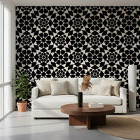 Black and white circle wallpaper in a lounge with a cream sofa and jute rug GD12506