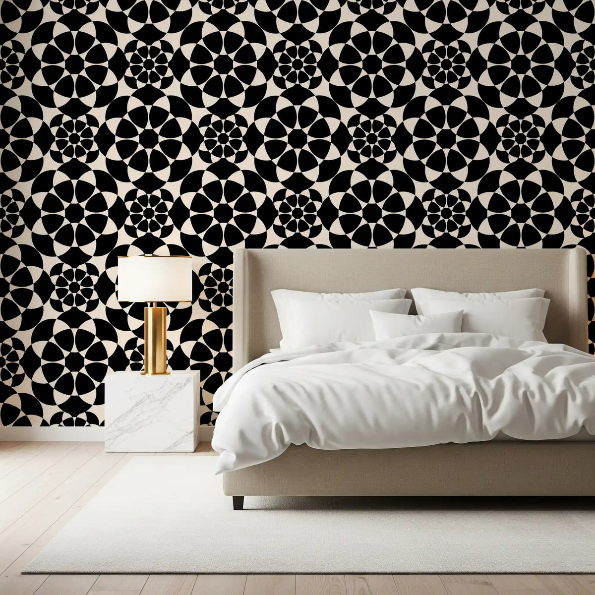 Monochrome circle wallpaper behind a beige bed with a gold lamp and marble nightstand GD12506