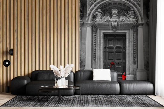 Baroque doorway mural in a lounge with a black leather sofa and wood slat wall GD12619