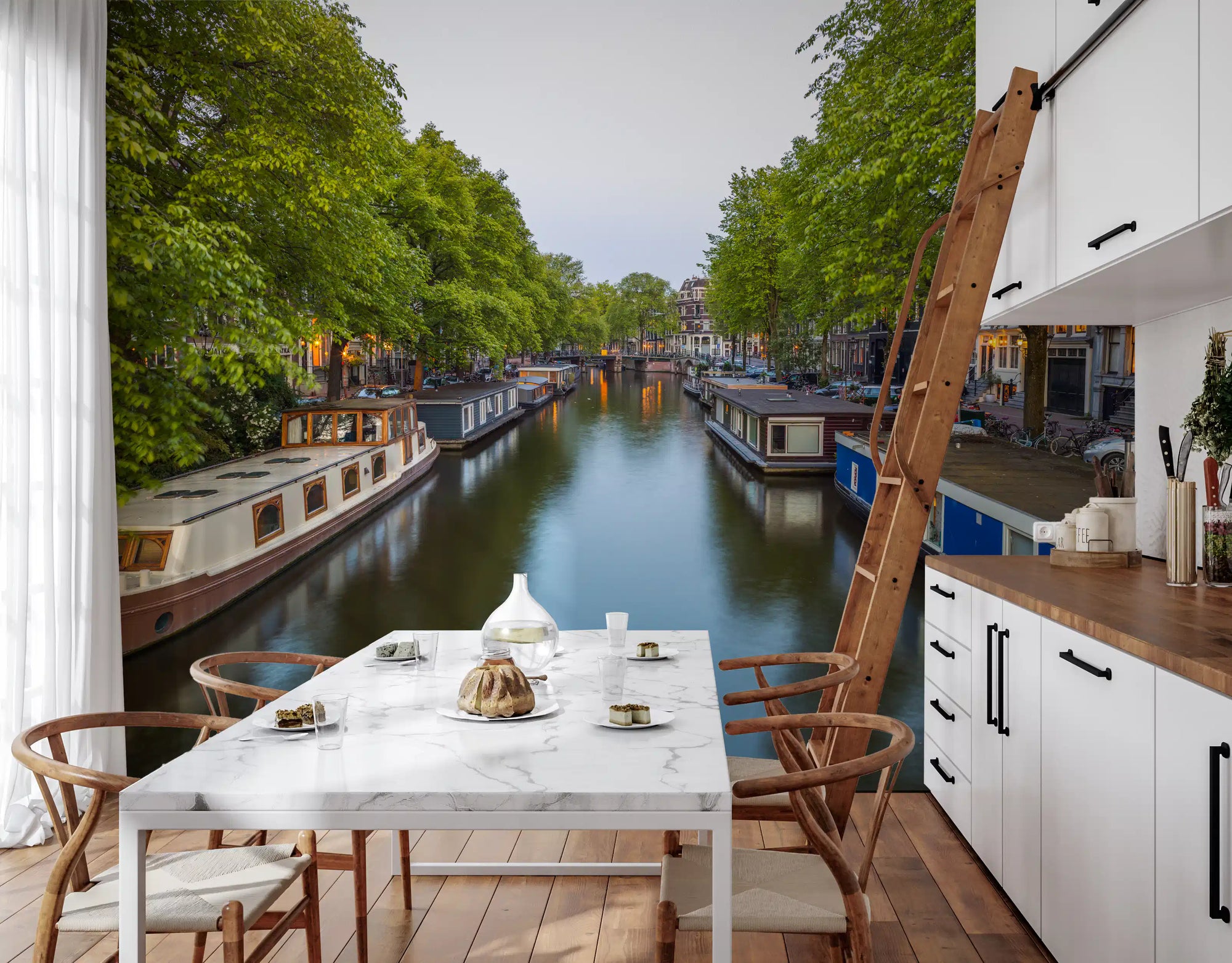 Amsterdam canal mural behind a marble dining table with wishbone chairs GD12624