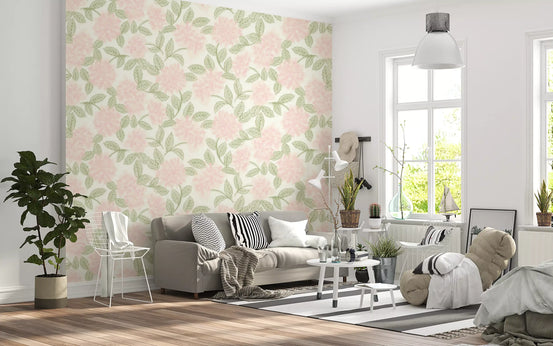 Blush bloom botanical wallpaper behind a grey sofa in a bright living room GD12637