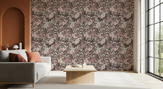 Muted sage and rose garden motif wallpaper behind a grey sofa near a terracotta arch GD12673