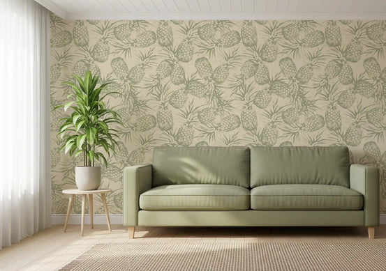 Sage green pineapple wallpaper behind a green leather sofa in a bright living room GD12682