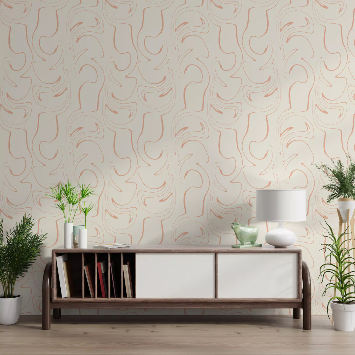 Soft blush swirls wallpaper behind a wooden sideboard and potted plants in a bright living room GD12705