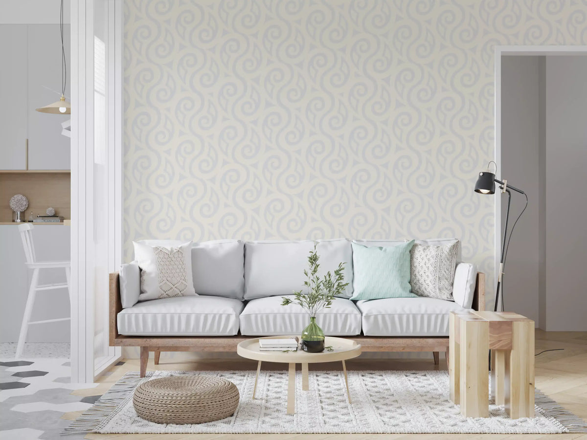 Cream and grey swirl wallpaper behind a light grey sofa near an open kitchen GD12709