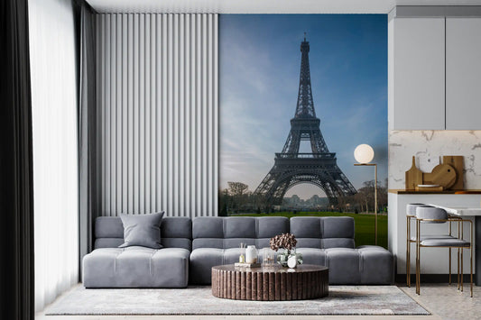Paris Eiffel Tower mural above a grey modular sofa and round coffee table GD12784