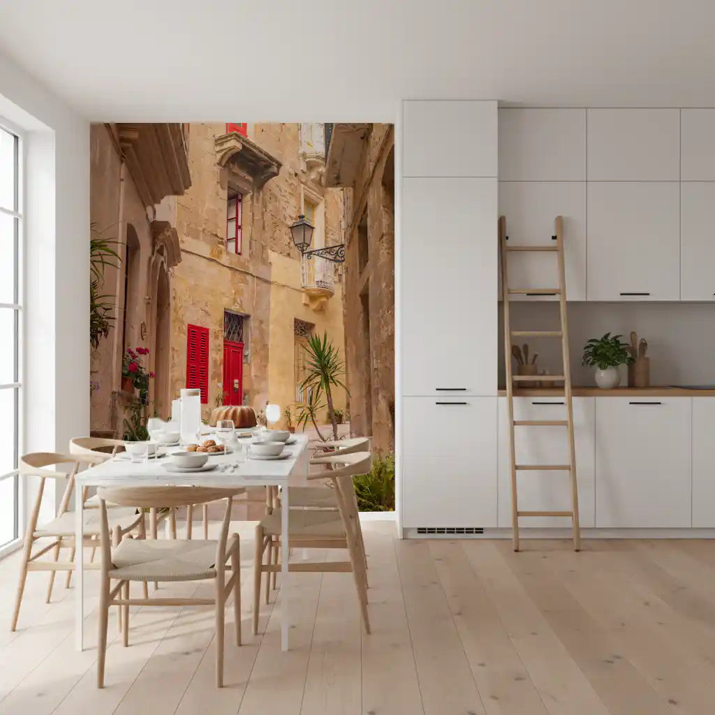 Rustic European streetscape mural behind a white dining table and kitchen GD12796