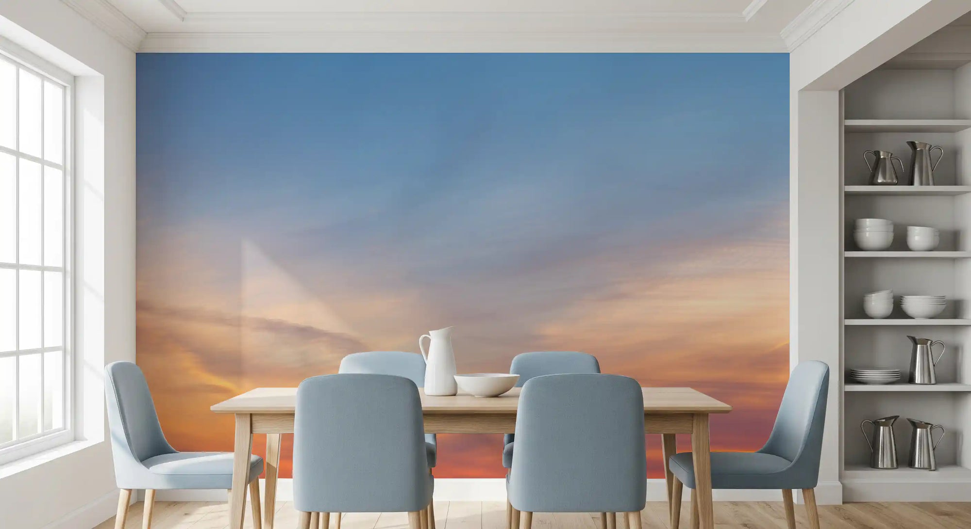 Amber dusk sky wall mural behind a dining table with soft blue chairs GD12809