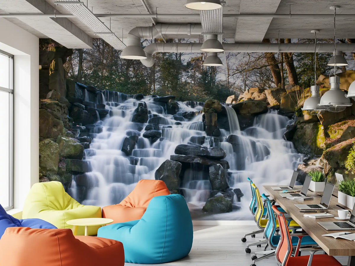 Rugged Mountain Brook Scenery wall mural behind colourful bean bags and a long desk GD12816