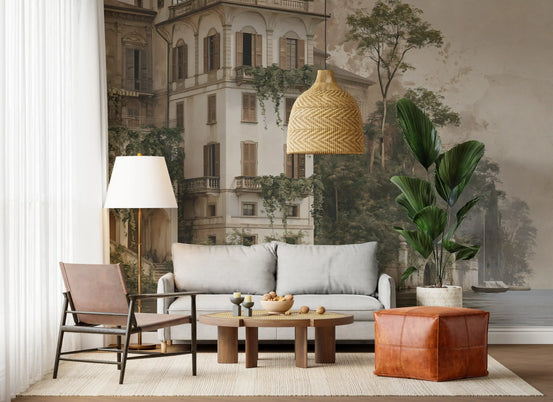 Villa Silvia mural behind a grey sofa with a rattan pendant and leather chair GD12880
