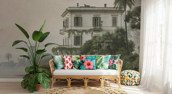 Vintage villa by the water mural behind a rattan loveseat with tropical cushions GD12881
