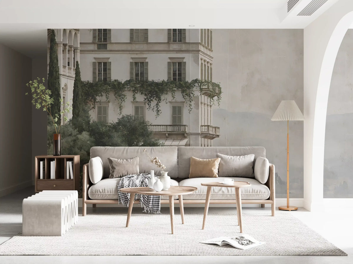 Grey sofa and wood coffee table against a misty lakefront manor mural GD12885