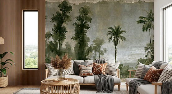 Aged tropical forest mural behind a cream sofa with rust pillows and woven table GD12966