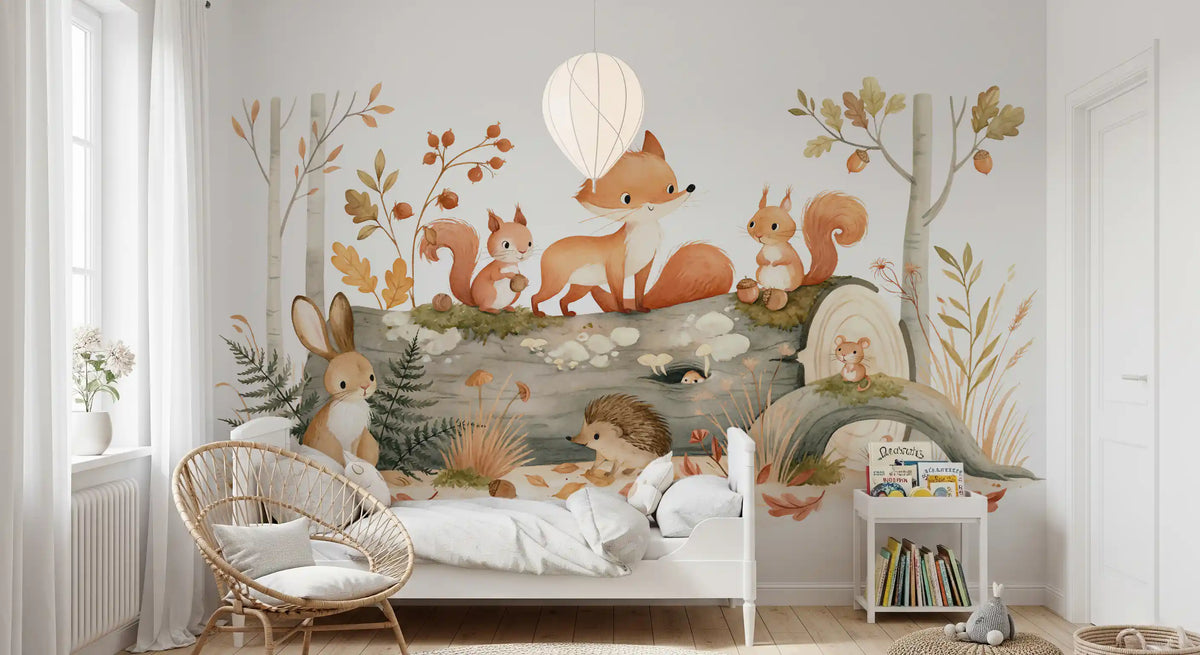 Forest wallpaper mural behind a white nursery crib with rattan chair and soft bedding GD12990