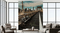New York wallpaper in a bright living room with grey chairs and tall windows GD13034