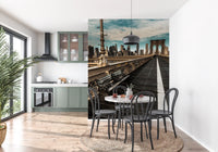 New York wallpaper in a kitchen with a dining table and green cabinets GD13034