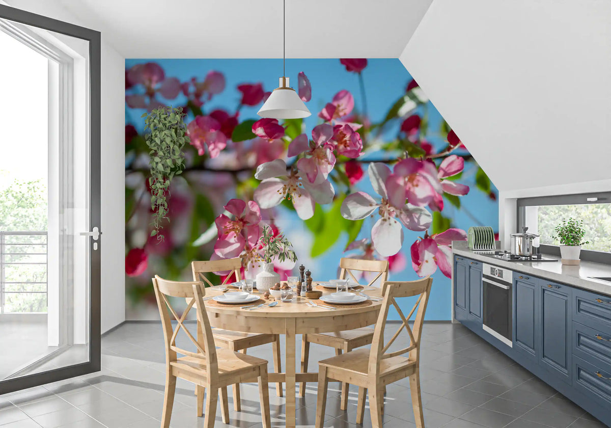 Cherry blossom wallpaper in a kitchen with blue cabinets and a round table GD13035