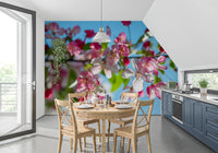 Cherry blossom wallpaper in a kitchen with blue cabinets and a round table GD13035