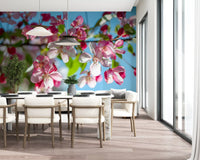 Cherry blossom wallpaper in a dining room with white chairs and a window GD13035
