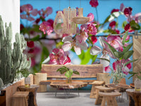 Cherry blossom wallpaper in a boho living room with cacti and a wood table GD13035