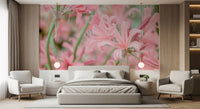 Floral wallpaper in a bedroom with a grey bed and matching armchairs GD13036
