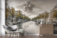 City wallpaper of a Dutch canal in a bedroom corner with grey chair GD13043