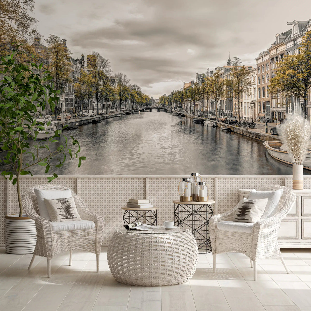 City wallpaper of a canal behind white cane chairs in a bright room GD13043