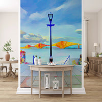 Riverside bridge artistic wallpaper above a round console table with candles GD13044