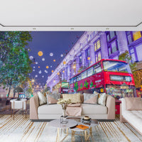 Living room sofa below the red bus and festive London street mural GD13045