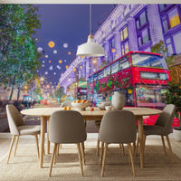 Oval dining table in front of the festive London street night mural GD13045