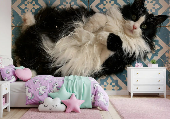 Girls bedroom with pastel bedding and cat wallpaper on a blue tiled feature wall GD13121