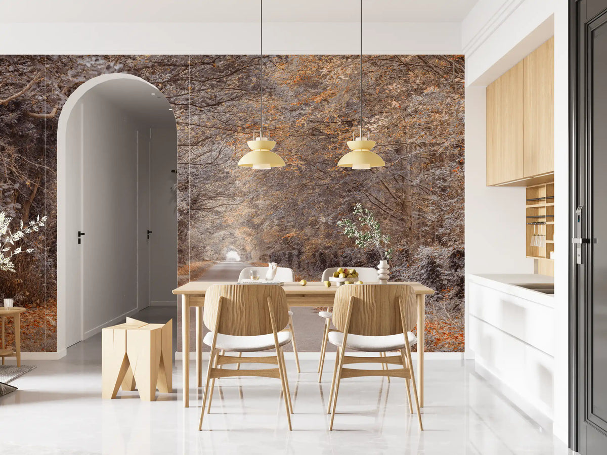 Forest wallpaper mural behind wood dining set with gold pendant lamps and white arched doorway GD13159