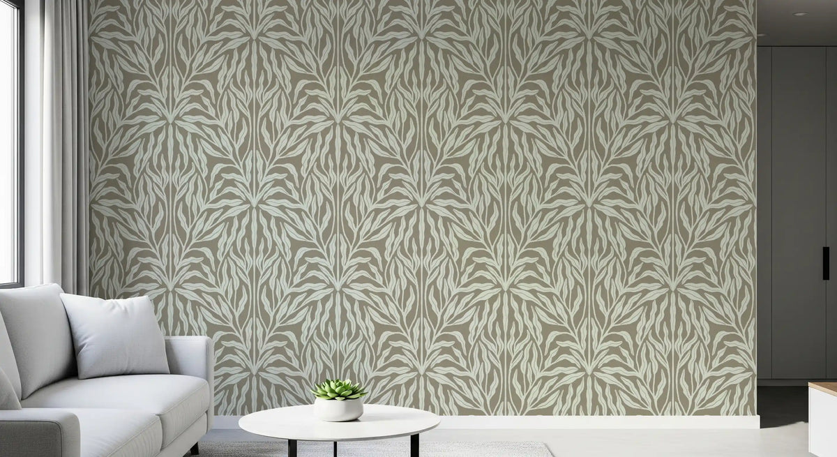 Corner of a living room with white sofa and round side table by leaf wallpaper GD13184